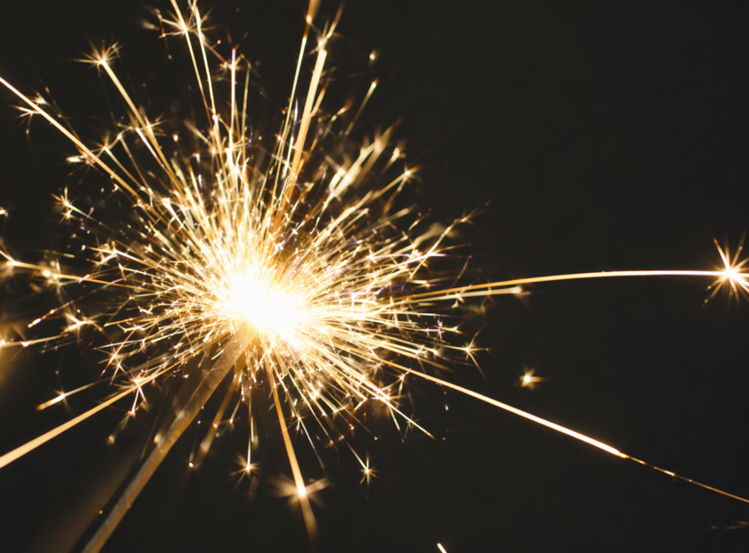 Close-up image of sparklers light at night.