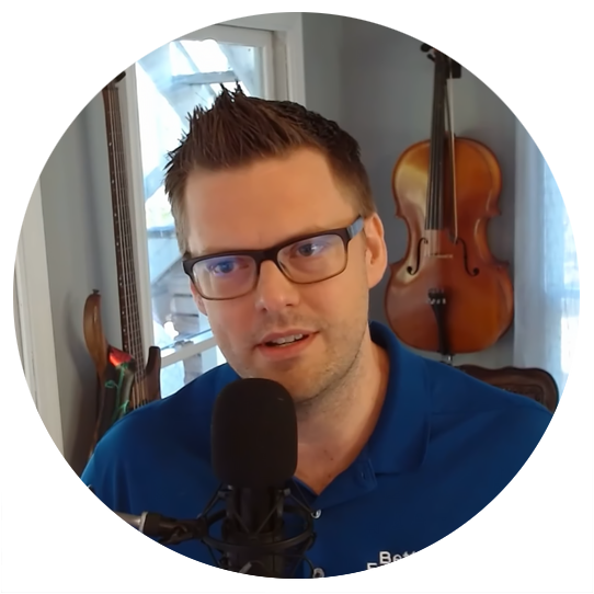 Gair Maxwell speaks in front of an audience with hands raised.