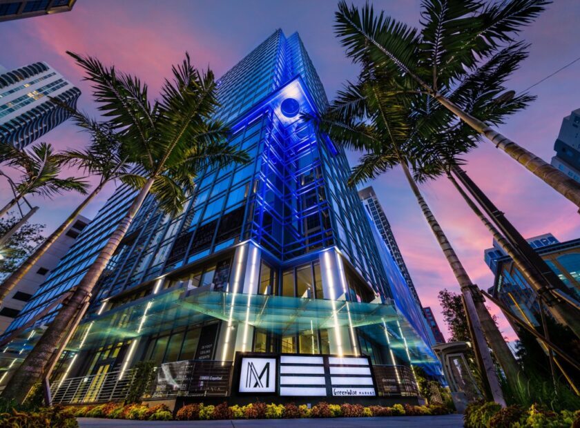 Ground photo looking up at The Main in Fort Lauderdale, Florida at night.